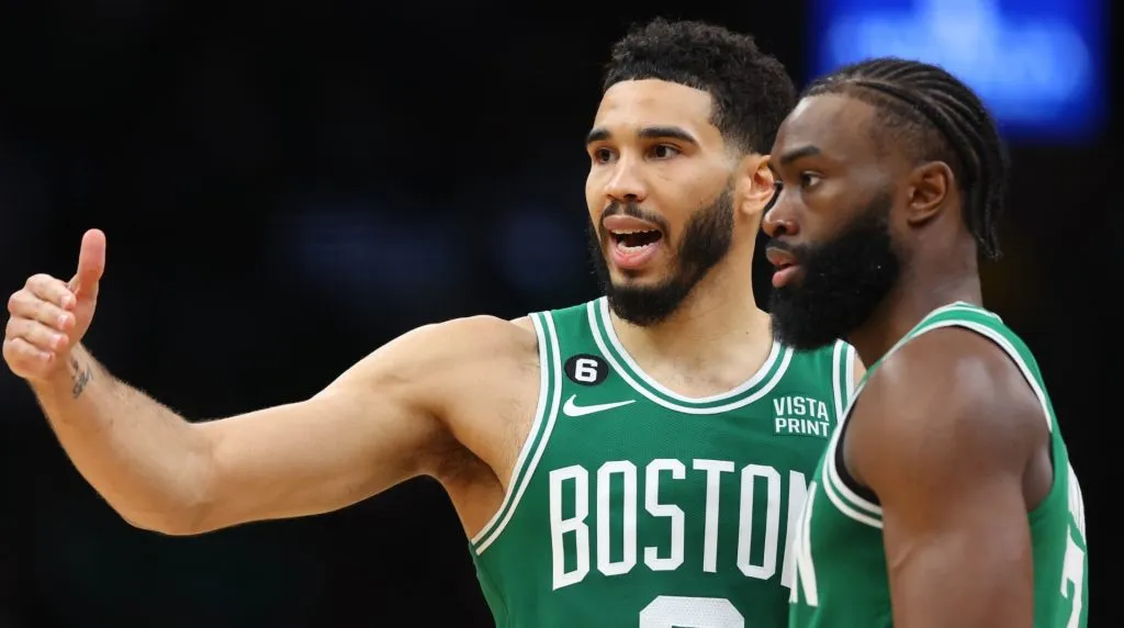 Jayson Tatum and Jaylen Brown talking in a game against Miami Heat