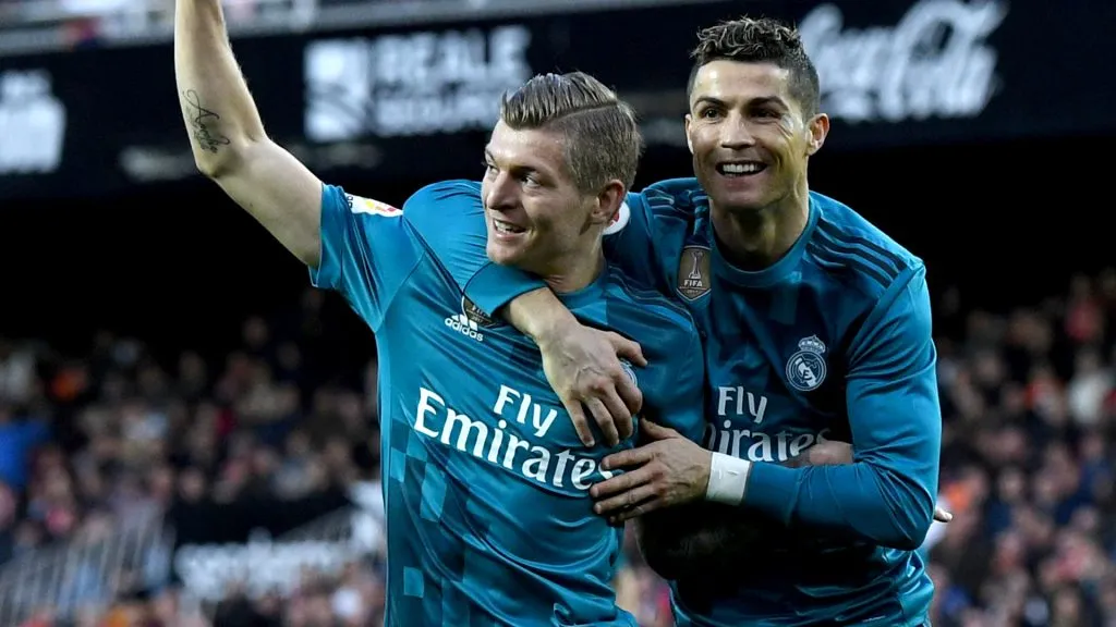 Toni Kroos of Real Madrid celebrates with teammate Cristiano Ronaldo after scoring his sides fourth goal during the La Liga match between Valencia and Real Madrid. David Ramos/Getty Images