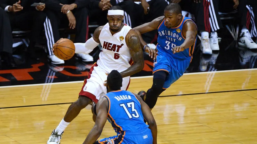 LeBron James #6 of the Miami Heat drives in the first quarter against James Harden #13 and Kevin Durant #35 of the Oklahoma City Thunder in Game Three of the 2012 NBA Finals on June 17, 2012. Ronald Martinez/Getty Images