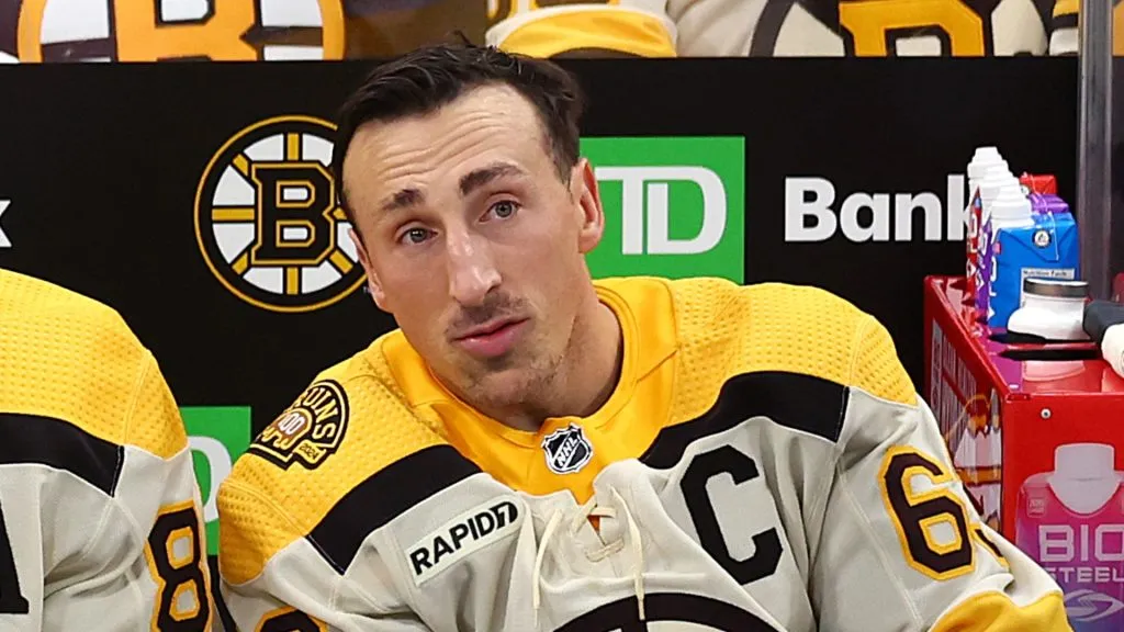 Brad Marchand #63 of the Boston Bruins talks with David Pastrnak #88 before the Bruins home opener against the Chicago Blackhawks at TD Garden on October 11, 2023 in Boston, Massachusetts.