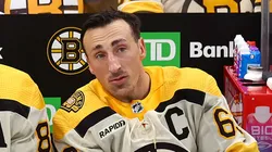 Brad Marchand #63 of the Boston Bruins talks with David Pastrnak #88 before the Bruins home opener against the Chicago Blackhawks at TD Garden on October 11, 2023 in Boston, Massachusetts.