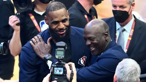 Michael Jordan and LeBron James hug after the presentation of the NBA 75th Anniversary Team during the 2022 NBA All-Star Game at Rocket Mortgage Fieldhouse on February 20, 2022 in Cleveland, Ohio.