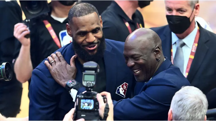 Michael Jordan and LeBron James hug after the presentation of the NBA 75th Anniversary Team during the 2022 NBA All-Star Game at Rocket Mortgage Fieldhouse on February 20, 2022 in Cleveland, Ohio.