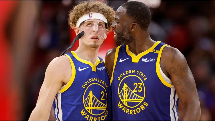 Draymond Green #23 of the Golden State Warriors congratulates Brandin Podziemski #2 in the second half against the Houston Rockets at Toyota Center on November 02, 2024 in Houston, Texas.