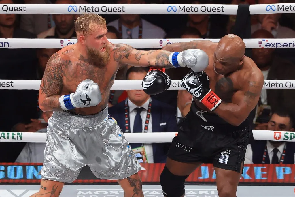 ARLINGTON, TEXAS – NOVEMBER 15: Jake Paul throws a left on Mike Tyson during a heavyweight bout at AT&T Stadium on November 15, 2024 in Arlington, Texas. (Photo by Christian Petersen/Getty Images)