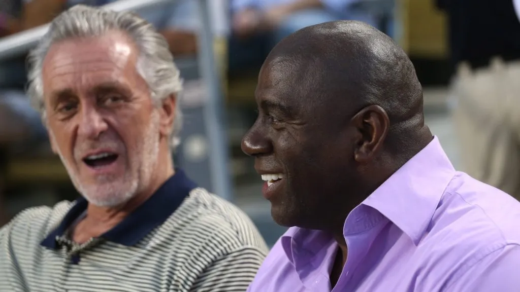  Los Angeles Dodgers part owner and former Los Angeles Laker Magic Johnson (R) talks with Miami Heat President and former Lakers head coach Pat Riley during the game with the San Francisco Giants on August 22, 2012 at Dodger Stadium in Los Angeles, California.