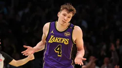 Dalton Knecht #4 of the Los Angeles Lakers reacts after scoring his fourth consecutive 3-point basket against the Utah Jazz during the third quarter of the Emirates NBA Cup at Crypto.com Arena on November 19, 2024 in Los Angeles, California.