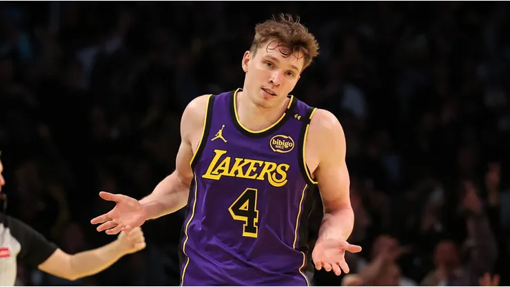 Dalton Knecht #4 of the Los Angeles Lakers reacts after scoring his fourth consecutive 3-point basket against the Utah Jazz during the third quarter of the Emirates NBA Cup at Crypto.com Arena on November 19, 2024 in Los Angeles, California.