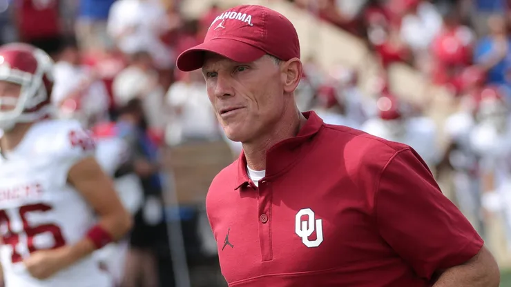 Oklahoma Sooners head coach Brent Venables runs on the field before the start of the NCAA, College League, USA Football game between the Oklahoma Sooners and the Tulsa Golden Hurricane at H.A. Chapman Stadium in Tulsa, OK.