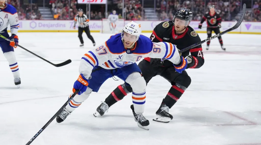 Connor McDavid #97 of the Edmonton Oilers skates with the puck against Tyler Kleven #43 of the Ottawa Senators during the third period at Canadian Tire Centre on November 19, 2024 in Ottawa, Ontario, Canada. (Photo by Chris Tanouye/Freestyle Photography/Getty Images)