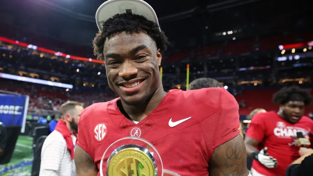 Jalen Milroe #4 of the Alabama Crimson Tide poses with the MVP trophy after defeating the Georgia Bulldogs 27-24 in the SEC Championship at Mercedes-Benz Stadium on December 02, 2023. (Source: Kevin C. Cox/Getty Images)
