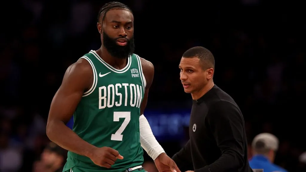 Jaylen Brown #7 of the Boston Celtics is greeted by head coach Joe Mazzulla as he heads to the bench at Madison Square Garden on October 25, 2023 in New York City.