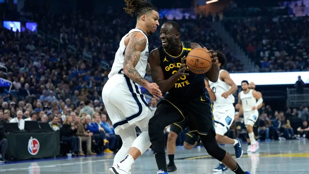 Draymond Green #23 of the Golden State Warriors drives to the basket on Brandon Clarke #15 of the Memphis Grizzlies in the first quarter during the Emirates NBA Cup game at Chase Center. Thearon W. Henderson/Getty Images