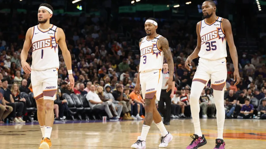 Devin Booker #1, Bradley Beal #3 and Kevin Durant #35 of the Phoenix Suns walk on the court during the first half of the NBA game against the Los Angeles Lakers at Footprint Center. (Christian Petersen/Getty Images)