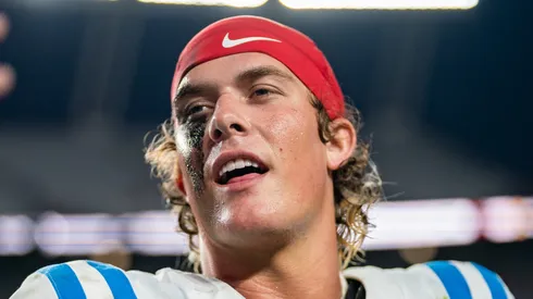 Jaxson Dart #2 of the Mississippi Rebels holds up a phone while walking off the field after defeating the South Carolina Gamecocks during their game at Williams-Brice Stadium on October 05, 2024 in Columbia, South Carolina.