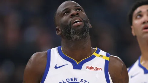 Draymond Green #23 and Trayce Jackson-Davis #32 of the Golden State Warriors look up at a replay during a 102-99 loss to the LA Clippers at Intuit Dome on November 18, 2024 in Inglewood, California.
