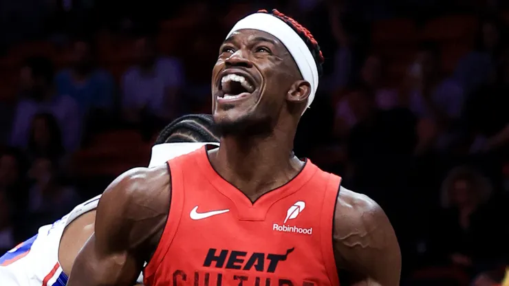 Jimmy Butler #22 of the Miami Heat drives to the net ahead of Guerschon Yabusele #28 of the Philadelphia 76ers during the second half at Kaseya Center on November 18, 2024 in Miami, Florida.