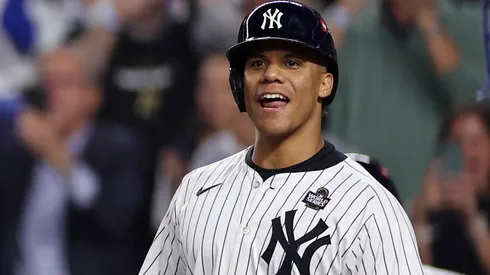 Juan Soto #22 of the New York Yankees waits to congratulate Aaron Judge #99 after Judge hit a two-run home run during the first inning of Game Five of the 2024 World Series against the Los Angeles Dodgers at Yankee Stadium on October 30, 2024 in the Bronx borough of New York City.
