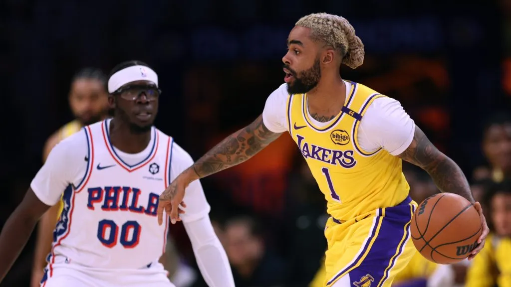 D’Angelo Russell #1 of the Los Angeles Lakers dribbles as he is guarded by Reggie Jackson #00 of the Philadelphia 76ers. Harry How/Getty Images