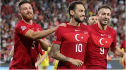 Hakan Calhanoglu of Turkey celebrates with teammates