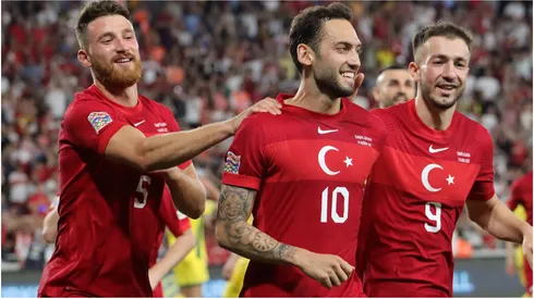 Hakan Calhanoglu of Turkey celebrates with teammates