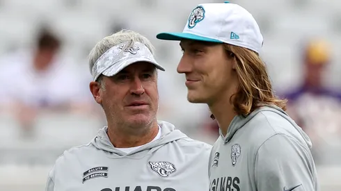 Head coach Doug Pederson and Trevor Lawrence #16 of the Jacksonville Jaguars speak before the game against the Minnesota Vikings at EverBank Stadium on November 10, 2024 in Jacksonville, Florida.