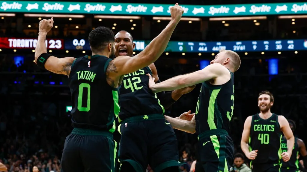 Jayson Tatum #0 of the Boston Celtics and Al Horford #42 celebrate Tatum’s game winning shot at the buzzer in overtime tohat defeated the Toronto Raptors at TD Garden. (Winslow Townson/Getty Images)