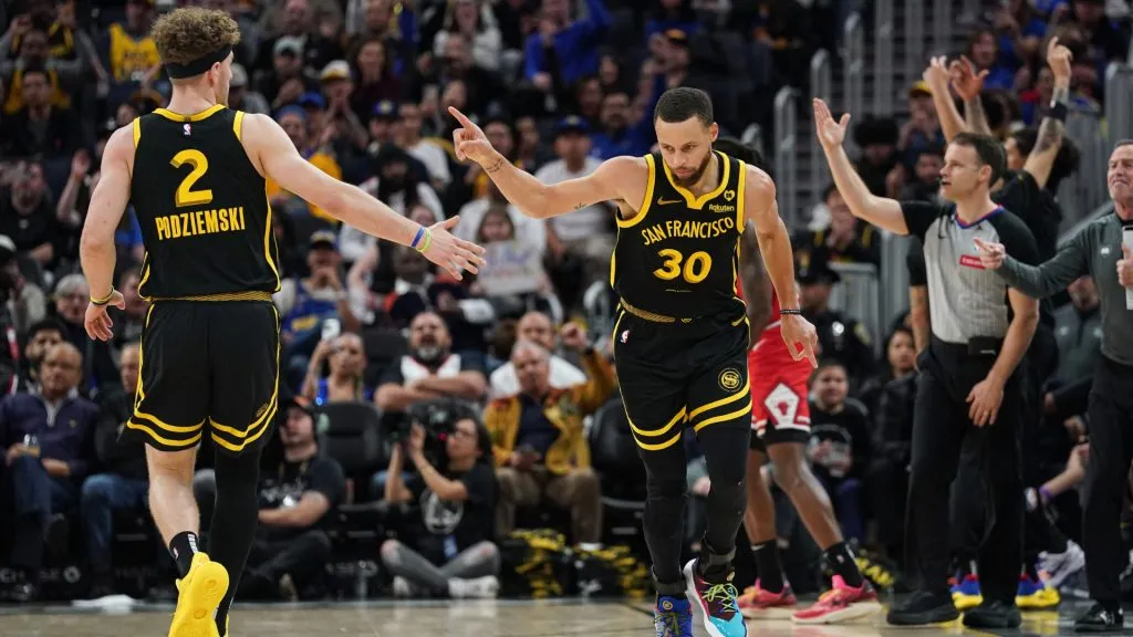 Brandin Podziemski #2 and Stephen Curry #30 of the Golden State Warriors celebrate a basket in the fourth quarter against the Chicago Bulls at Chase Center. (Kavin Mistry/Getty Images)
