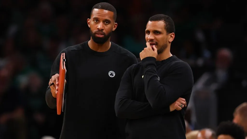 Assistant coach Charles Lee (L) of the Boston Celtics speaks to head coach Joe Mazzulla during the third quarter against the Cleveland Cavaliers in Game Two of the Eastern Conference Second Round Playoffs at TD Garden on May 09, 2024 in Boston, Massachusetts.