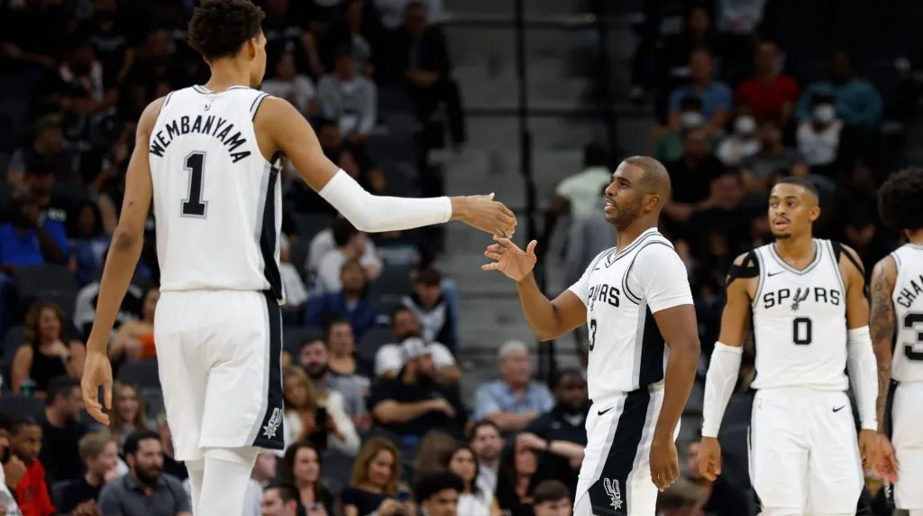 Victor Wembanyama #1 of the San Antonio Spurs is congratulated by Chris Paul #3 during a game against the Portland Trail Blazers in the second half at Frost Bank Center on November 7, 2024 in San Antonio, Texas. (Photo by Ronald Cortes/Getty Images)