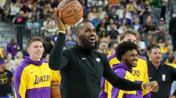 (L-R) Dalton Knecht #4, LeBron James #23 and Bronny James #9 of the Los Angeles Lakers warm up before a preseason game against the Golden State Warriors at T-Mobile Arena at T-Mobile Arena on October 15, 2024 in Las Vegas, Nevada.