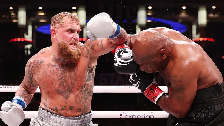 (L-R) Jake Paul and Mike Tyson fight during LIVE On Netflix: Jake Paul vs. Mike Tyson at AT&T Stadium on November 15, 2024 in Arlington, Texas.