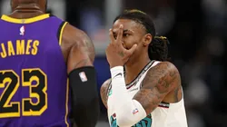 Ja Morant #12 of the Memphis Grizzlies reacts against LeBron James #23 of the Los Angeles Lakers during the first half at FedExForum on November 06, 2024 in Memphis, Tennessee.