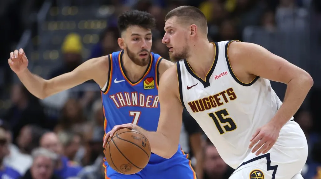 Nikola Jokic #15 of the Denver Nuggets drives against Chet Holmgren #7 of the Oklahoma City Thunder in the fourth quarter at Ball Arena on October 24, 2024 in Denver, Colorado. (Photo by Matthew Stockman/Getty Images)