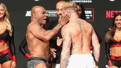 Mike Tyson slaps Jake Paul as they face off during their ceremonial weigh-in at The Pavilion at Toyota Music Factory on November 14, 2024 in Irving, Texas. The two are scheduled to meet in a heavyweight bout on November 15 at AT&T Stadium in Arlington, Texas.