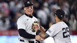Aaron Judge #99 and Gleyber Torres #25 of the New York Yankees congratulate each other after the yankees defeated the Los Angeles Dodgers 11-4 to win Game Four of the 2024 World Series at Yankee Stadium on October 29, 2024 in the Bronx borough of New York City.