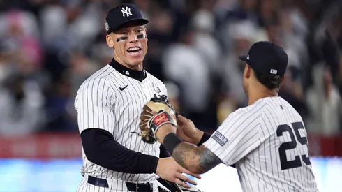 Aaron Judge #99 and Gleyber Torres #25 of the New York Yankees congratulate each other after the yankees defeated the Los Angeles Dodgers 11-4 to win Game Four of the 2024 World Series at Yankee Stadium on October 29, 2024 in the Bronx borough of New York City.