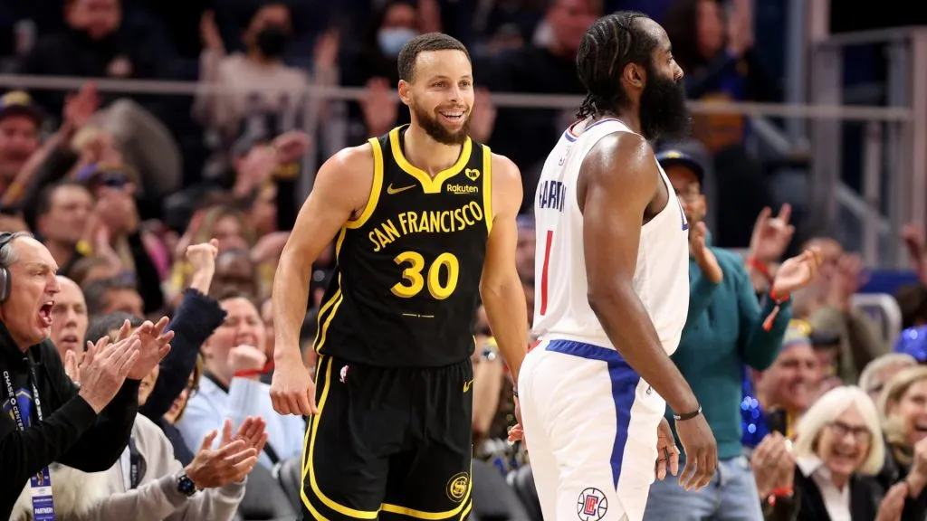 Stephen Curry #30 of the Golden State Warriors reacts after he made a three-point basket on James Harden #1 of the LA Clippers at Chase Center on February 14, 2024 in San Francisco, California.