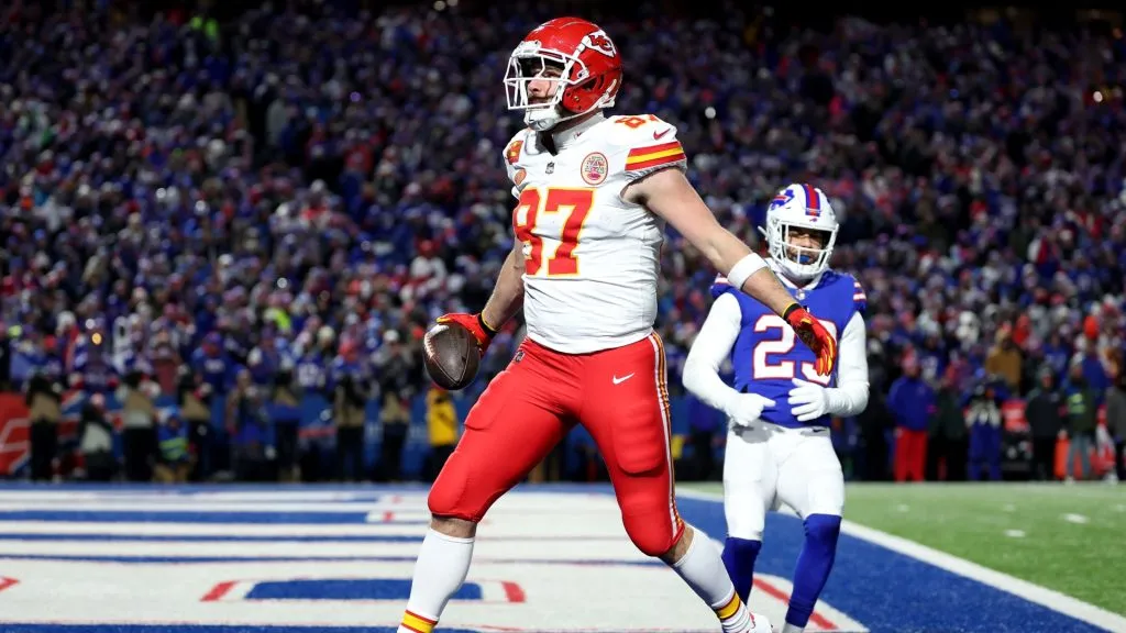 Travis Kelce #87 of the Kansas City Chiefs celebrates after scoring a 22 yard touchdown against the Buffalo Bills during the second quarter in the AFC Divisional Playoff game at Highmark Stadium on January 21, 2024 in Orchard Park, New York.