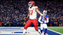 Travis Kelce #87 of the Kansas City Chiefs celebrates after scoring a 22 yard touchdown against the Buffalo Bills during the second quarter in the AFC Divisional Playoff game at Highmark Stadium on January 21, 2024 in Orchard Park, New York.