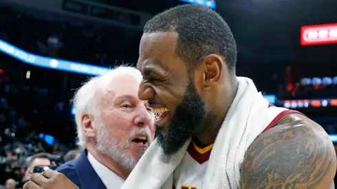 LeBron James #23 of the Cleveland Cavaliers is congratulated by Gregg Popovich head coach of the San Antonio Spurs at the end of the game at AT&T Center on January 23, 2018 in San Antonio, Texas.
