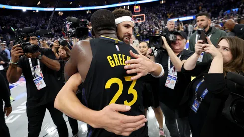 Klay Thompson #31 of the Dallas Mavericks hugs former teammate Draymond Green #23 of the Golden State Warriors after their game at Chase Center on November 12, 2024 in San Francisco, California. This is Thompson's first game back in Golden State after he was traded to Dallas after last season.