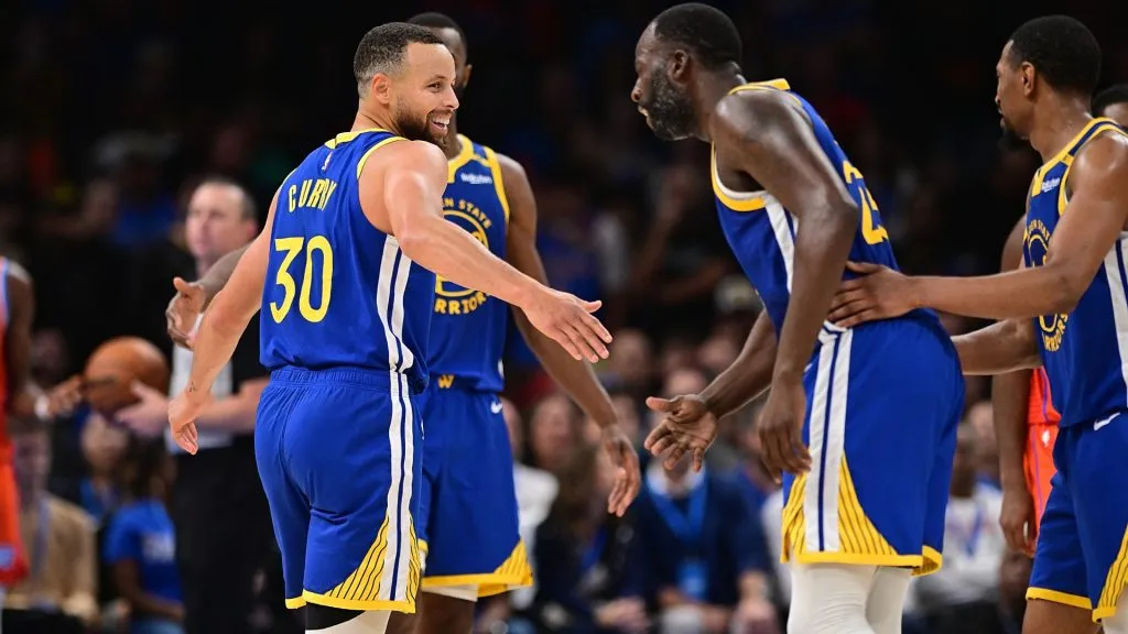 Stephen Curry #30 and Draymond Green #23 of the Golden State Warriors celebrate during the second half against the Oklahoma City Thunder at Paycom Center on November 10, 2024 in Oklahoma City, Oklahoma. (Photo by Joshua Gateley/Getty Images)