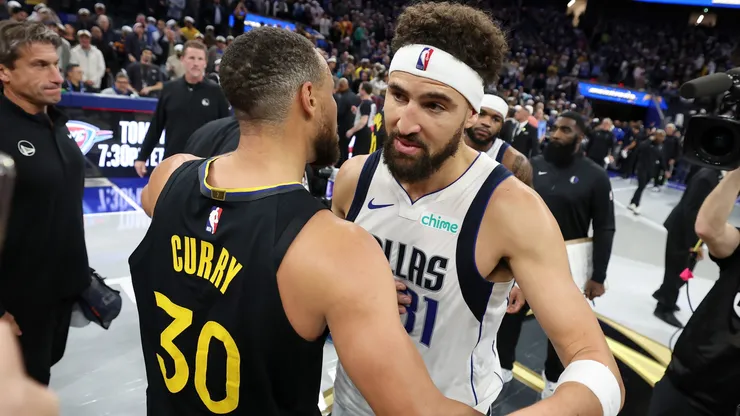 Klay Thompson #31 of the Dallas Mavericks hugs former teammate Stephen Curry #30 of the Golden State Warriors after their game at Chase Center on November 12, 2024 in San Francisco, California. This is Thompson's first game back in Golden State after he was traded to Dallas after last season.
