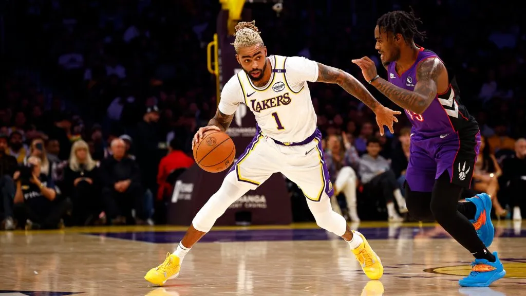 D’Angelo Russell #1 of the Los Angeles Lakers controls the ball against Davion Mitchell #45 of the Toronto Raptors in the first half at Crypto.com Arena. Ronald Martinez/Getty Images