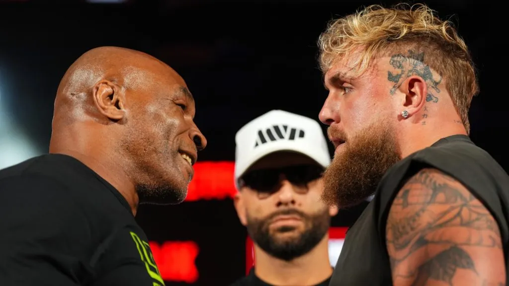 (L-R) Mike Tyson, Nakisa Bidarian and Jake Paul pose onstage during the Jake Paul vs. Mike Tyson Boxing match Arlington press conference at Texas Live! on May 16, 2024 in Arlington, Texas. (Photo by Cooper Neill/Getty Images for Netflix)