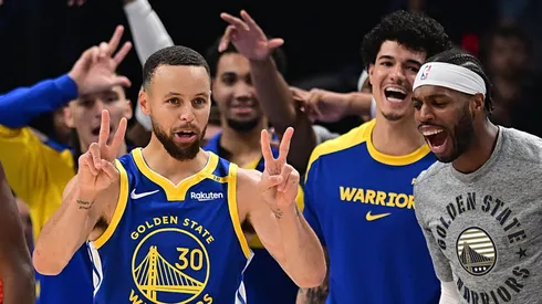 Stephen Curry #30 of the Golden State Warriors reacts in front of his bench after scoring in the second half against the Oklahoma City Thunder at Paycom Center on November 10, 2024 in Oklahoma City, Oklahoma.