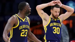 Draymond Green #23 and Stephen Curry #30 of the Golden State Warriors display frustration with a foul call during the second half of a game against the Los Angeles Lakers at Crypto.com Arena.