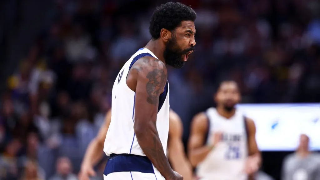 Kyrie Irving #11 of the Dallas Mavericks reacts to a three-point shot in the second half against the Denver Nuggets at Ball Arena. Tyler Schank/Clarkson Creative/Getty Images