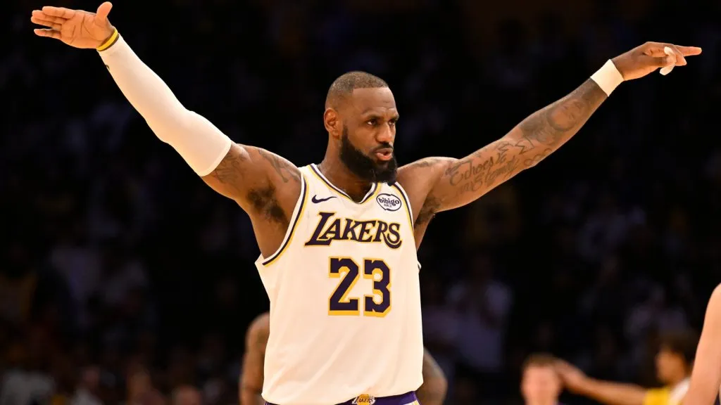 LeBron James #23 of the Los Angeles Lakers asks for the crowd to quiet down as Anthony Davis #3 shots free throws against the Sacramento Kings. John McCoy/Getty Images